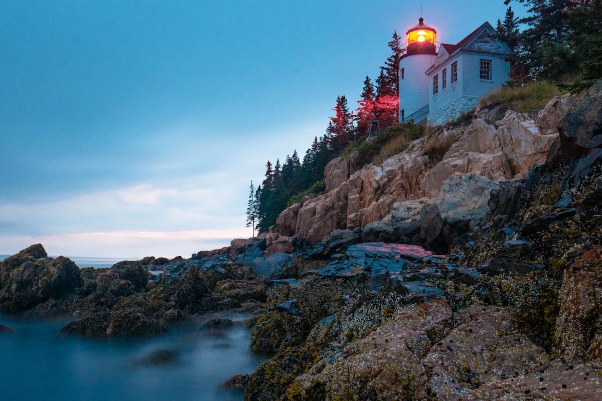Pet transportation in Maine - lighthouse on rocky Atlantic coastline