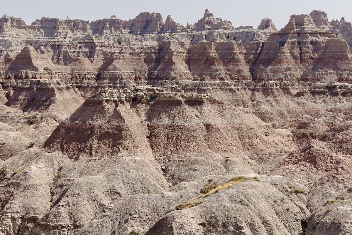 Pet transportation in North Dakota - Badlands rock formations and grasslands